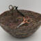 This is looking inside the bowl, seeing the scissors tied on to the loop with ribbon.